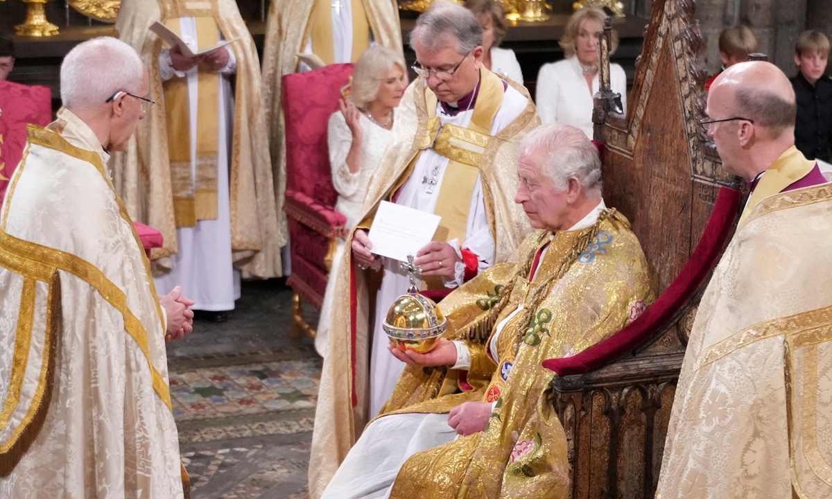 King Charles III is presented with The Sovereign's Orb by The Archbishop of Canterbury the Most Reverend Justin Welby during his coronation ceremony at Westminster Abbey in London. Photo: VCG