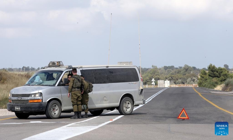 Israeli soldiers check a vehicle near Sderot in southern Israel near the border with Gaza, on May 9, 2023. Israel was on high alert on Tuesday as it prepared for retaliatory rocket attacks from the Gaza Strip after a series of Israeli airstrikes killed militants and civilians in the coastal Palestinian enclave.(Photo: Xinhua)