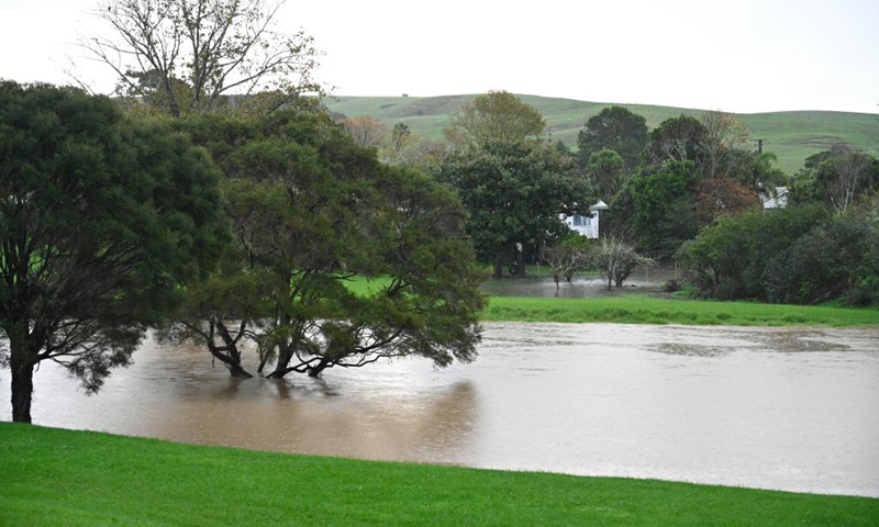 This photo taken on May 9, 2023 shows a rising river in Auckland, New Zealand. New Zealand's Auckland declared local state of emergency following floods and torrential downpours on Tuesday.(Photo: Xinhua)