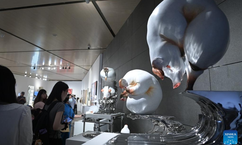 Visitors view sculptures at 2023 China Central Academy of Fine Arts (CAFA) postgraduate works exhibition in Beijing, capital of China, May 9, 2023. Over 3,000 pieces of postgraduate works were displayed in the exhibition, including paintings, sculptures, digital art, etc(Photo: Xinhua)