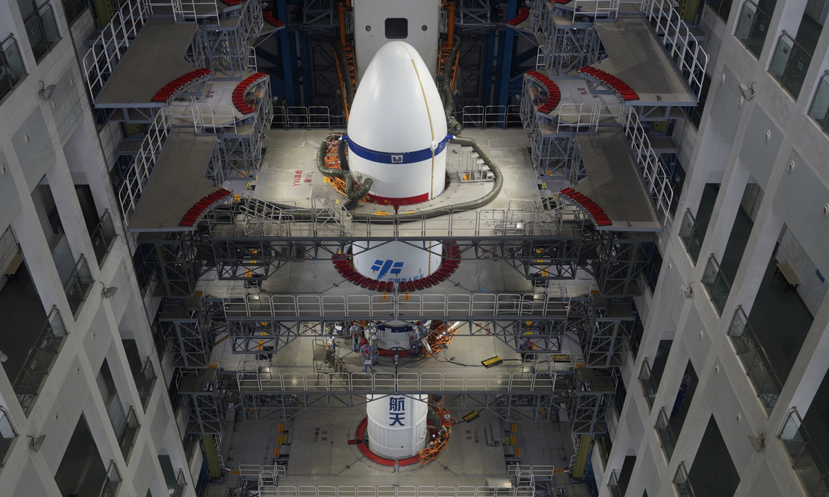 The Long March 7 carrier rocket makes final preparations inside the rocket assembly and test building in Hainan Province. Photo: Fan Wei/GT
