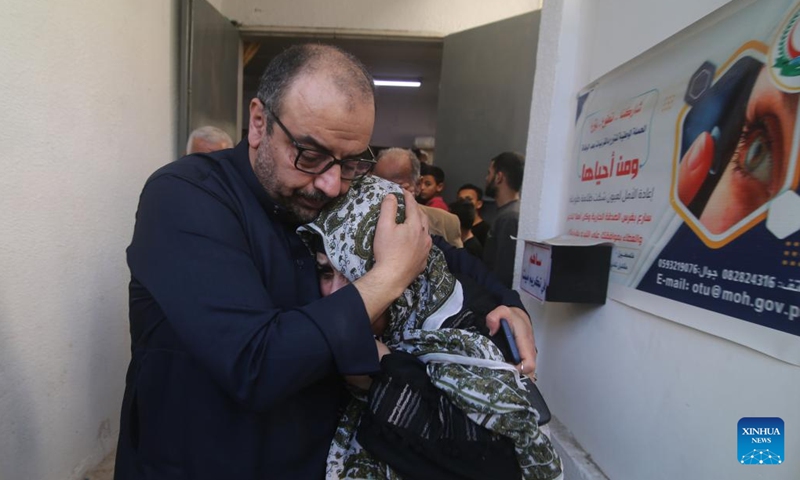 Palestinians mourn at a hospital in the southern Gaza Strip city of Rafah, on May 10, 2023. At least 21 Palestinians were killed and 64 were injured in the continuing Israeli airstrikes on the Gaza Strip, said the Palestinian Health Ministry in Gaza on Wednesday.(Photo: Xinhua)