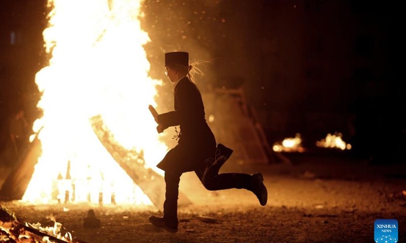 An ultra-Orthodox Jew participates in celebrations of the Jewish holiday of Lag BaOmer in Ashdod, Israel, on May 8, 2023.(Photo: Xinhua)