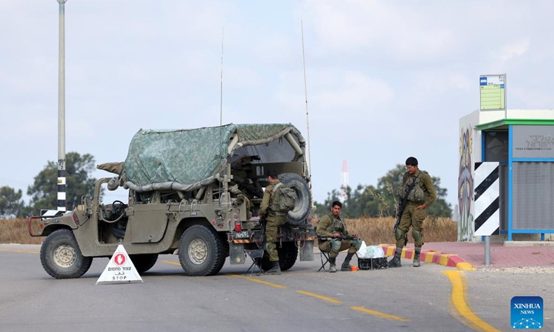 Israeli soldiers block a road near Sderot in southern Israel near the border with Gaza, on May 9, 2023. Israel was on high alert on Tuesday as it prepared for retaliatory rocket attacks from the Gaza Strip after a series of Israeli airstrikes killed militants and civilians in the coastal Palestinian enclave.(Photo: Xinhua)