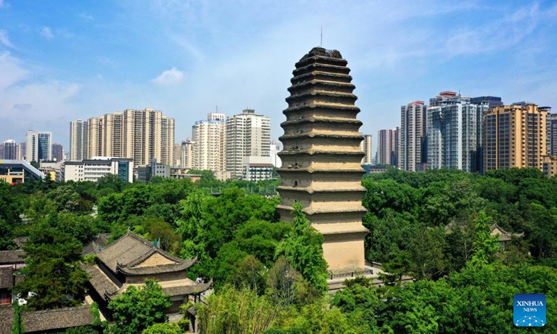 This aerial photo taken on May 8, 2023 shows a view of the Small Wild Goose Pagoda in Xi'an, northwest China's Shaanxi Province. Xi'an, a city with over 3,100 years of history, served as the capital for 13 dynasties in Chinese history. It is also home to the world-renowned Terracotta warriors created in the Qin Dynasty (221-207 BC).(Photo: Xinhua)
