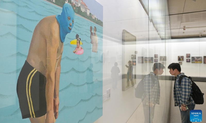 Visitors view oil paintings at 2023 China Central Academy of Fine Arts (CAFA) postgraduate works exhibition in Beijing, capital of China, May 9, 2023. Over 3,000 pieces of postgraduate works were displayed in the exhibition, including paintings, sculptures, digital art, etc(Photo: Xinhua)