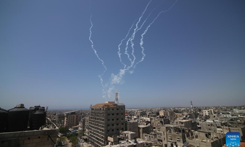 A barrage of rockets fired from Gaza into Israel are seen in the sky of southern Gaza Strip city of Rafah on May 10, 2023. The Gaza-based joint chamber of military operations of Palestinian factions claimed firing a barrage of rockets into Israel on Wednesday.(Photo: Xinhua)