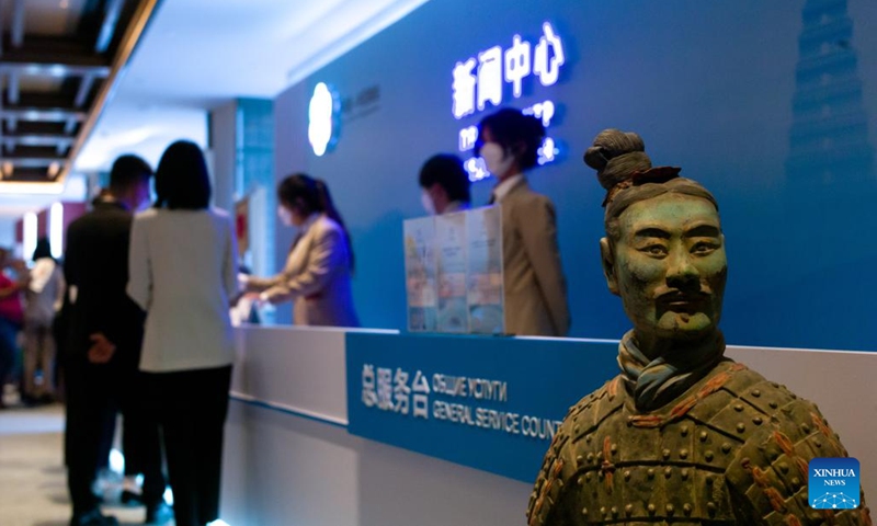 Journalists are seen at the service counter of the media center for the China-Central Asia Summit in Xi'an, northwest China's Shaanxi Province, May 16, 2023. The media center of the China-Central Asia Summit opened on Tuesday to provide services for journalists.(Photo: Xinhua)