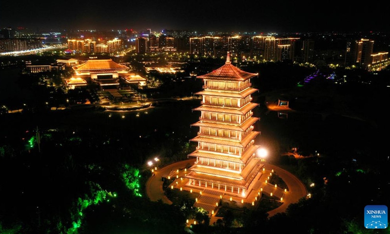 This aerial photo taken on May 1, 2023 shows a night view of the Chang'an Tower at the Chanba ecological zone in Xi'an, northwest China's Shaanxi Province. As the provincial capital of northwest China's Shaanxi Province, Xi'an, a city founded more than 3,100 years ago, served as the capital for 13 dynasties in Chinese history, including Tang (618-907), when the city was known as Chang'an.(Photo: Xinhua)