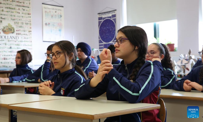 Students attend an online class on the benefits of Chinese acupressure techniques at St. Margaret College Secondary School in Cospiqua, Malta, on May 16, 2023. The online class on traditional Chinese medicine (TCM) was held with students at the China Corner at St. Margaret College Secondary School on Tuesday.(Photo: Xinhua)