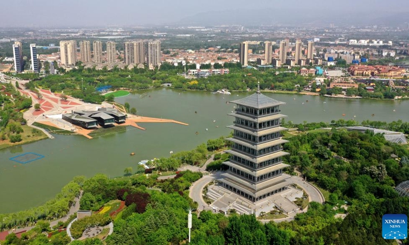 This aerial photo taken on April 16, 2023 shows a view of the Chang'an Tower at the Chanba ecological zone in Xi'an, northwest China's Shaanxi Province. Areas surrounding the Bahe River in historic city of Xi'an is picturesque and full of ecological vitality(Photo: Xinhua)