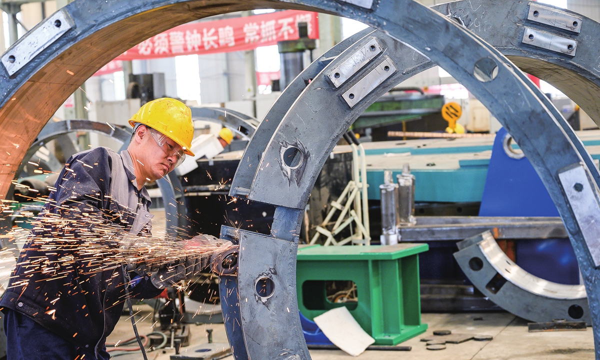 Workers make equipment for export at a factory in Taiyuan, North China's Shanxi Province on May 11, 2023. China's total merchandise trade expanded 4.8 percent year-on-year in the first quarter of 2023, reversing a decline of 0.8 percent in the first two months of the year, official data showed. Photo: cnsphoto