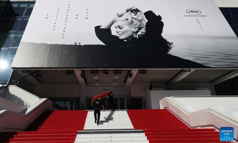 Staff members install the red carpet at the Palais des Festivals ahead of the 76th edition of the Cannes Film Festival in Cannes, southern France, May 16, 2023. The film festival will be held from May 16 to 27 this year.(Photo: Xinhua)