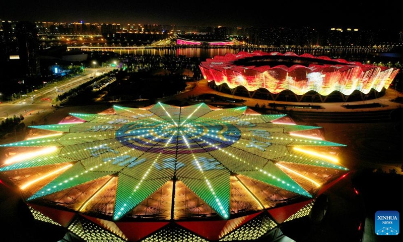 This aerial photo taken on May 1, 2023 shows a night view of the Olympic Sports Center in Xi'an, northwest China's Shaanxi Province. Areas surrounding the Bahe River in historic city of Xi'an is picturesque and full of ecological vitality.(Photo: Xinhua)