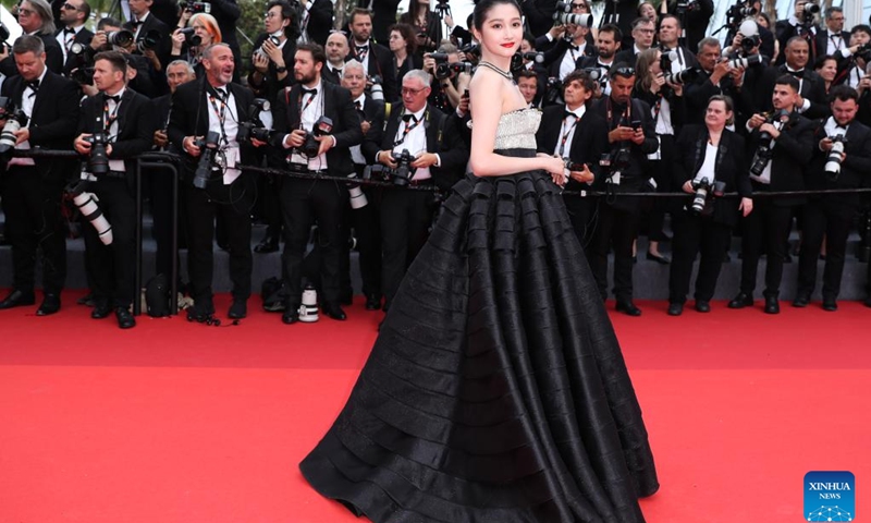 Actress Guan Xiaotong arrives for the opening ceremony of the 76th edition of the Cannes Film Festival in Cannes, southern France, on May 16, 2023. The 76th edition of the Cannes Film Festival kicked off on Tuesday evening, with 21 films selected to compete for the Palme d'Or top prize.(Photo: Xinhua)