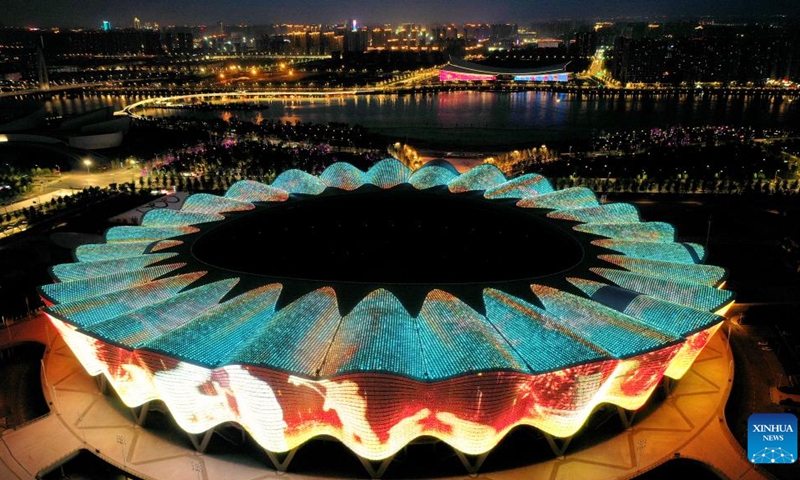 This aerial photo taken on May 1, 2023 shows a night view of the Olympic Sports Center in Xi'an, northwest China's Shaanxi Province. As the provincial capital of northwest China's Shaanxi Province, Xi'an, a city founded more than 3,100 years ago, served as the capital for 13 dynasties in Chinese history, including Tang (618-907), when the city was known as Chang'an.(Photo: Xinhua)