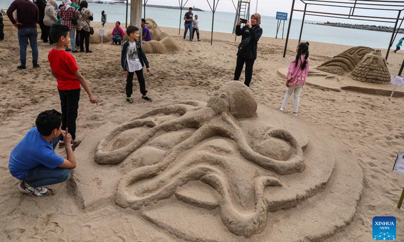 People view sand sculptures during a sand sculpture festival in Alexandria, Egypt, on May 10, 2023. The four-day Alexandria Sand Sculpture Festival, the first of its kind held by Alexandria governorate to promote tourism and encourage young talents, concluded on Wednesday evening.(Photo: Xinhua)