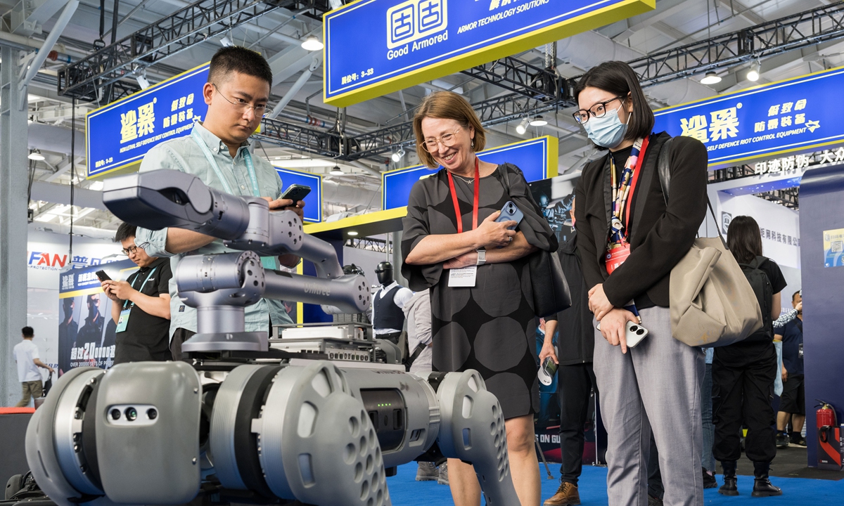 Visitors look at a product at the 11th China International Exhibition on Police Equipment at the Beijing Shougang Exhibition & Convention Center in Beijing on May 12, 2023. The four-day exhibition has drawn 619 domestic companies and 40 foreign companies. Since 2002, the event has become a widely influential police equipment exhibition in the Asia-Pacific region and even the world.  Photos: Chen Tao/GT
