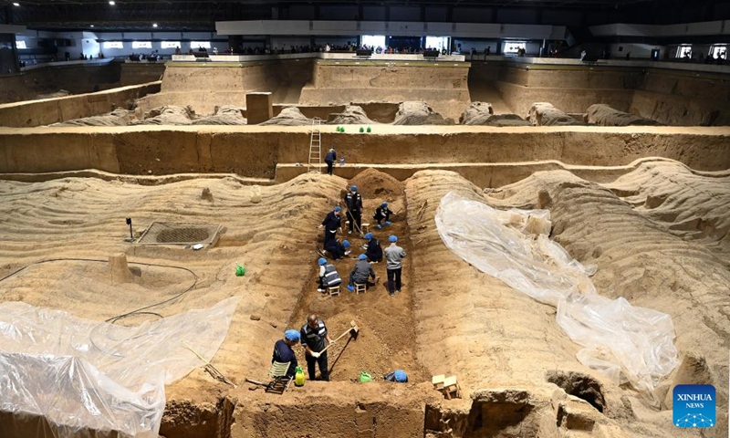 Staff members work at the pit No.2 of the Emperor Qinshihuang's Mausoleum Site Museum in Xi'an, northwest China's Shaanxi Province, April 26, 2023. Xi'an, a city with over 3,100 years of history, served as the capital for 13 dynasties in Chinese history. It is also home to the world-renowned Terracotta warriors.(Photo: Xinhua)