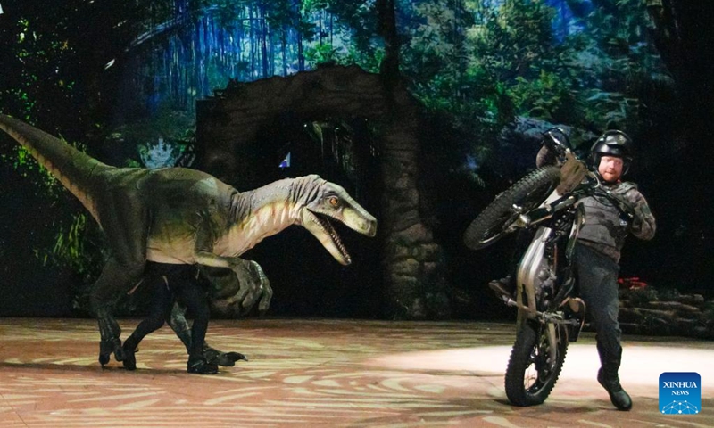 Cast members rehearse during a behind-the-scene preview of the Jurassic World Live Tour show in Vancouver, British Columbia, Canada, on May 12, 2023. The behind-the-scene preview of the making of the Jurassic World Live Tour show was presented here on Friday. The show will be held here from May 19 to May 28. (Photo by Liang Sen/Xinhua)