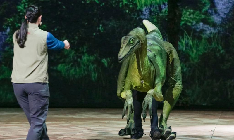 Cast members rehearse during a behind-the-scene preview of the Jurassic World Live Tour show in Vancouver, British Columbia, Canada, on May 12, 2023. The behind-the-scene preview of the making of the Jurassic World Live Tour show was presented here on Friday. The show will be held here from May 19 to May 28. (Photo by Liang Sen/Xinhua)
