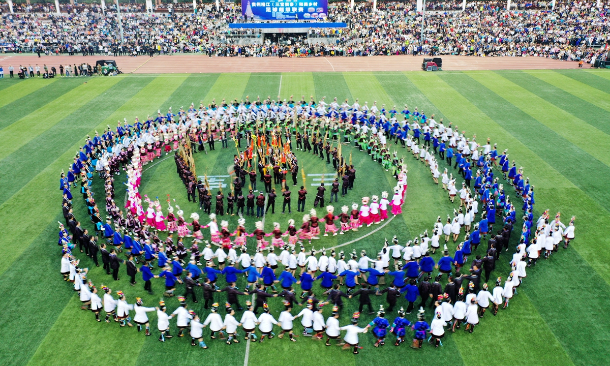 A village soccer “super league” in Qiandongnan Miao and Dong Autonomous Prefecture, Southwest China’s Guizhou Province, kicks off on May 13, 2023, with 20 teams attending the event and villagers in minority costumes dancing in circles to cheer for them. Photo: VCG