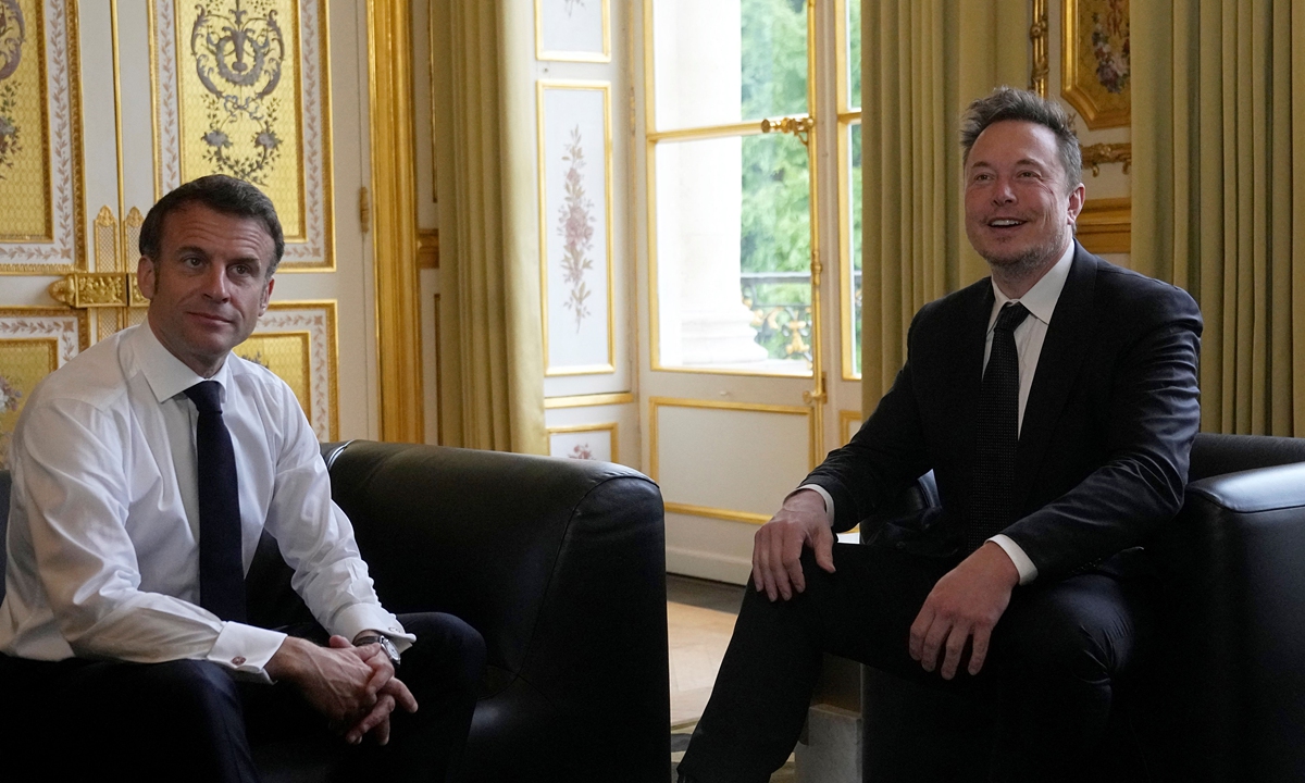 SpaceX, Twitter and electric car maker Tesla CEO Elon Musk (right) meets with France's President Emmanuel Macron in Paris on May 15, 2023. The billionaire entrepreneur is in France to attend the six edition of the annual 