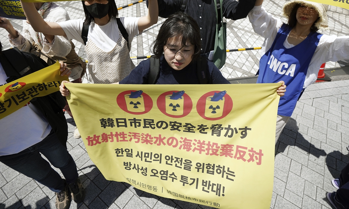 Protesters including people from South Korea gather for a rally outside Tokyo Electric Power Company Holdings (TEPCO) headquarters building on May 16, 2023, in Tokyo. They demanded Japan scrap its plan to start dumping enormous amounts of stored nuclear-contaminated wastewater into the sea. Photo: VCG