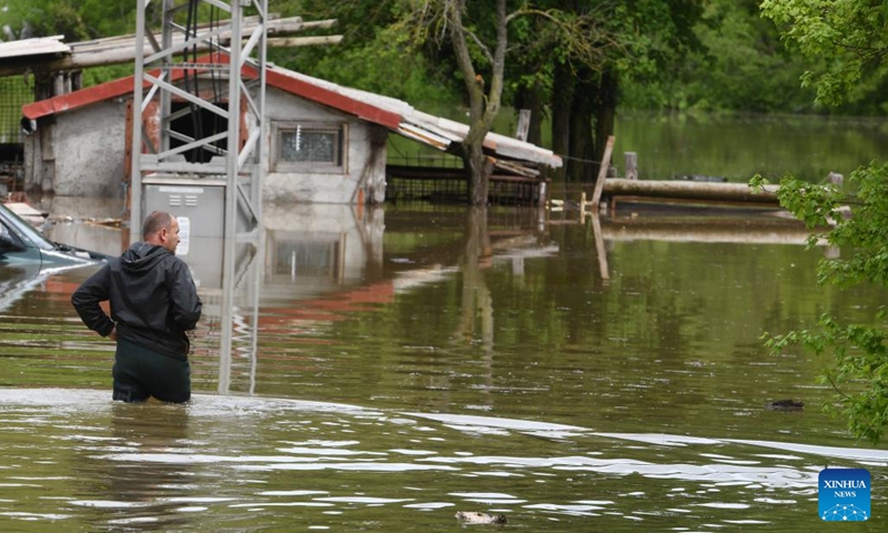 A man stands in a flooded area in Gracac, Croatia, on May 15, 2023.(Photo: Xinhua)