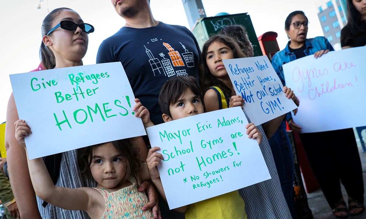 Local parents and children protest against city's decision of using public school gyms to house migrants on May 16, 2023, in Brooklyn, New York, the US. The city is now eyeing up to 20 schools with standalone gyms to house migrants, Mayor Eric Adams said, as 65,000 asylum seekers have come through the city so far, including 4,200 last week alone. Photo: IC