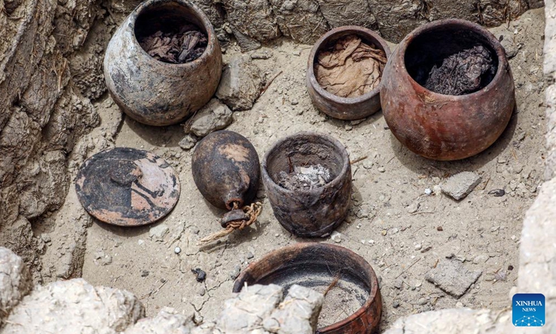 This photo taken on May 27, 2023 shows clay pots used in mummification unearthed at the archaeological site in Saqqara necropolis, south of the capital Cairo, Egypt. Egypt announced on Saturday the discovery of two ancient embalming workshops for humans and animals along with two tombs and a collection of artifacts in Saqqara necropolis, south of the capital Cairo. (Xinhua/Ahmed Gomaa)
