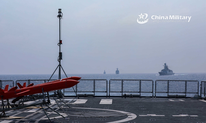 The guided-missile destroyer Dalian (Hull 105) attached to a destroyer flotilla with the navy under the PLA Southern Theater Command gets ready to launch two target drones during a coordination training exercise in early May, 2023. (eng.chinamil.com.cn/Photo by Yang Yunxiang)