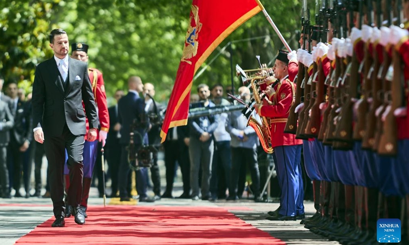 Montenegro's president-elect Jakov Milatovic (L) reviews the honor guard during his inauguration ceremony in Podgorica, Montenegro, May 20, 2023. Newly elected president of Montenegro Jakov Milatovic took the oath of office on Saturday at the country's parliament in Podgorica. (Photo by Predrag Milosavljevic/Xinhua)