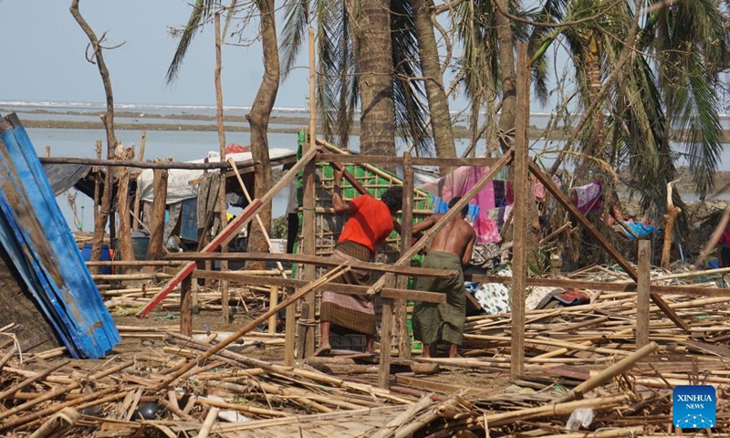 Villagers rebuild a house destroyed by Cyclone Mocha in Sittwe, Rakhine State, Myanmar, May 17, 2023. The death toll from Cyclone Mocha in Myanmar has reached 48 as of Wednesday afternoon, state media reported on Thursday.(Photo: Xinhua)
