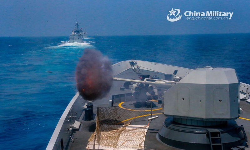 Naval vessels assigned to a destroyer flotilla with the navy under the PLA Southern Theater Command fire main guns at mock targets during a coordination training exercise in early May, 2023. (eng.chinamil.com.cn/Photo by Wang Jian)