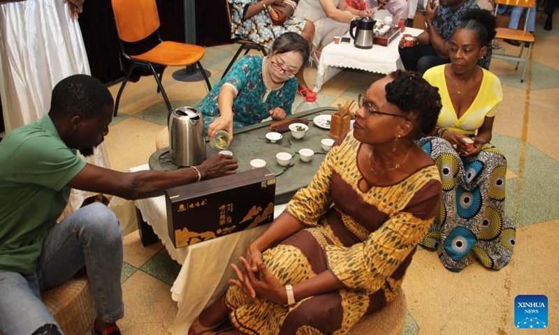 Guests taste tea at a tea-themed cultural event in Cotonou, Benin, May 20, 2023. A tea-promoting event was held in Cotonou of Benin on Saturday. Various event was held including tea tasting, tea ceremony performance, and Taij performance. The International Tea Day is observed every year on May 21. (Photo by Seraphin Zounyekpe/Xinhua)