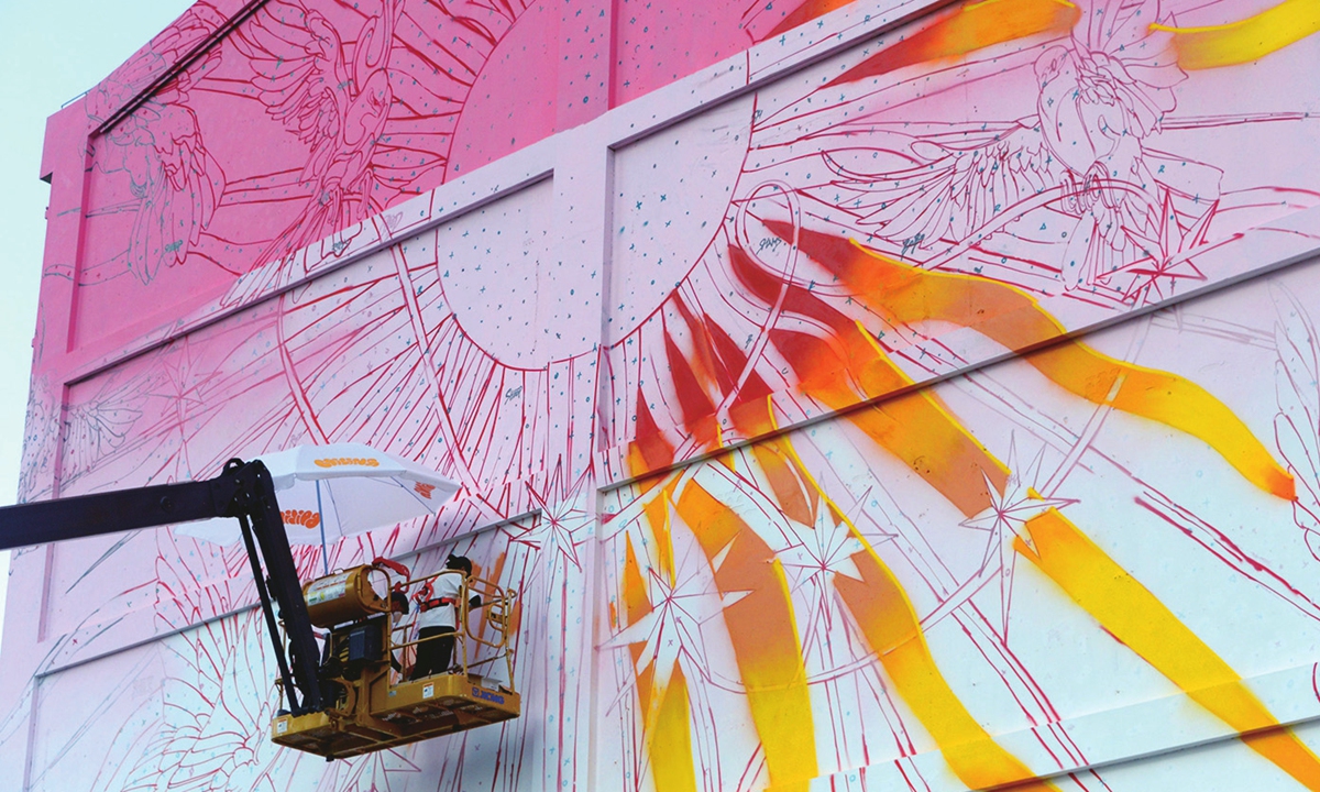 A large-scale wall painting full of artistic charm is about to be completed on the exterior wall of Chuangzhihui Park in Shanghai on May 15, 2023. Once home to the Shanghai Tractor Engine Factory, the exterior walls are now full of creativity, and residents can feel artists’ vision of love for the city’s future. Photo: IC