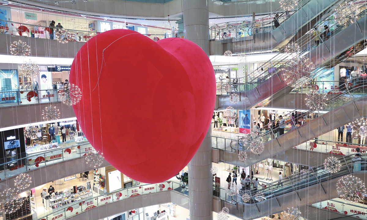 An oversized love heart is seen at a shopping mall on Dongdajie street in Xi'an, Northwest China's Shaanxi Province on May 16, 2023, creating a festive atmosphere for the upcoming 