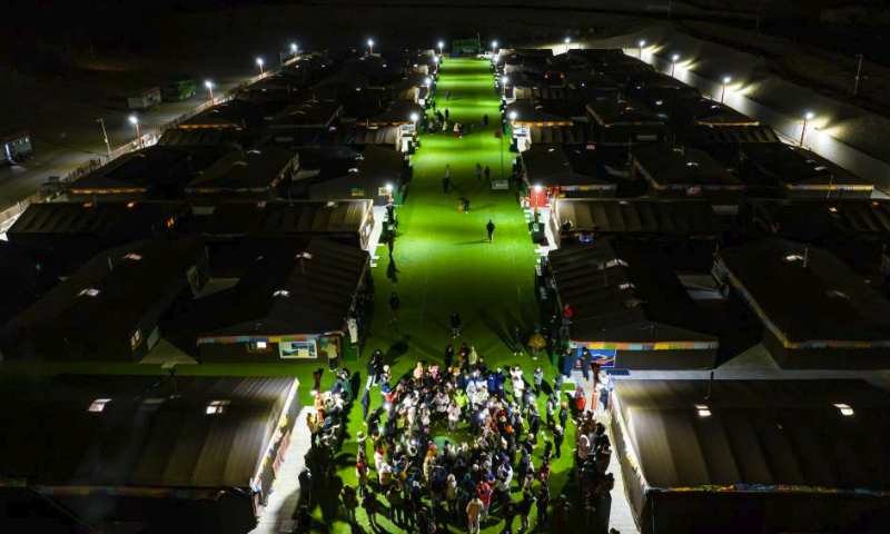 In this aerial photo, tourists sing and dance at the Mount Qomolangma base camp for tourists in Zhaxizom Township of Tingri County in Xigaze City, southwest China's Tibet Autonomous Region, May 16, 2023.

The Mount Qomolangma base camp for tourists is dotted with tent hotels that accommodate travelers from afar. The tents are made from black yak fur, a unique scene at the mountain foot.

Dainzin, a 27-year-old local has been running a tent hotel at the base camp for nearly a decade. He is a witness to the booming tourism growth here.

Access to running water, electricity, emergency vehicles and oxygen facilities has been realized. Convenience store, sweet tea house and post office are also available.

Farmers and herdsmen in the township manage the tent hotels at the base camp, which are set up in March and open until October every year. (Xinhua/Sun Fei)