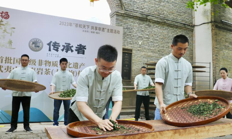 Staff show the making skills of Wuyi rock tea (Dahongpao) during a tea culture event held in Fuzhou, southeast China's Fujian Province, May 21, 2023. May 21 marks the International Tea Day. (Xinhua/Jiang Kehong)