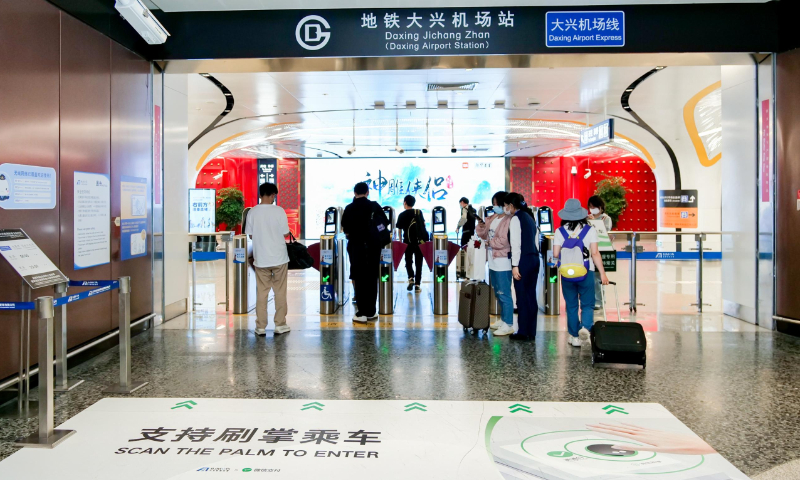Passengers can use the palm scanning service to check in at the Daxing Airport Metro Line in southern Beijing from May 21, 2023. Photo: web