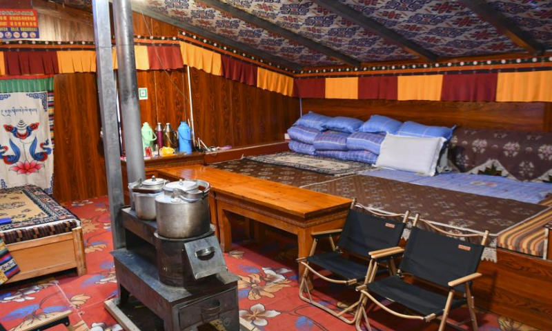 This photo taken on May 13, 2023 shows the interior of a tent hotel at the Mount Qomolangma base camp for tourists in Zhaxizom Township of Tingri County in Xigaze City, southwest China's Tibet Autonomous Region.

The Mount Qomolangma base camp for tourists is dotted with tent hotels that accommodate travelers from afar. The tents are made from black yak fur, a unique scene at the mountain foot.

Dainzin, a 27-year-old local has been running a tent hotel at the base camp for nearly a decade. He is a witness to the booming tourism growth here.

Access to running water, electricity, emergency vehicles and oxygen facilities has been realized. Convenience store, sweet tea house and post office are also available.

Farmers and herdsmen in the township manage the tent hotels at the base camp, which are set up in March and open until October every year. (Xinhua/Jigme Dorje)