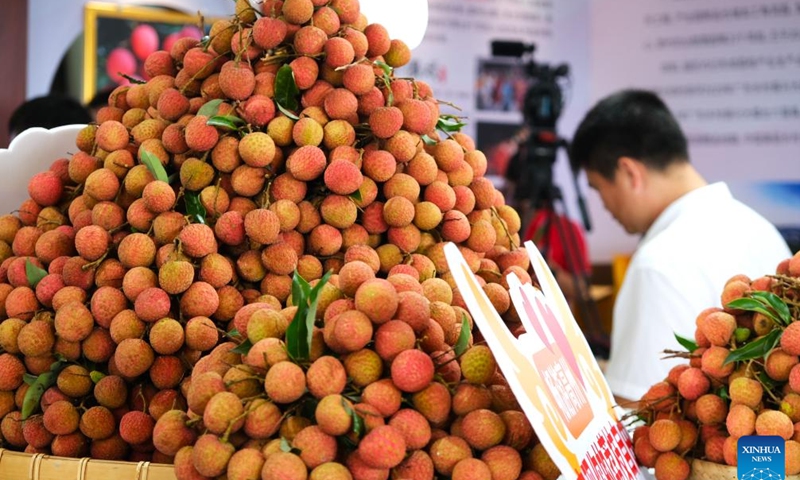 This photo taken on May 20, 2023 shows litchis displayed during the China International Tropical Crops Industry Conference and the 7th China Litchi and Longan Industry Conference in Maoming, south China's Guangdong Province. The conference kicked off here on Saturday. (Xinhua/Xiong Jiayi)