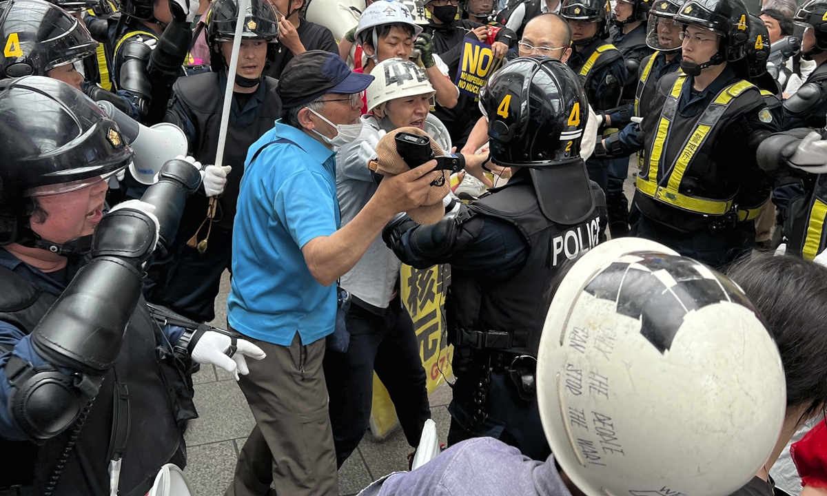 Protesters confront police during a march against the Group of Seven (G7) Summit held in Hiroshima, Japan on May 21, 2023. The protesters accused the G7 nations of escalating the Ukraine crisis, chanted anti-war slogans and hoisted banners calling for 