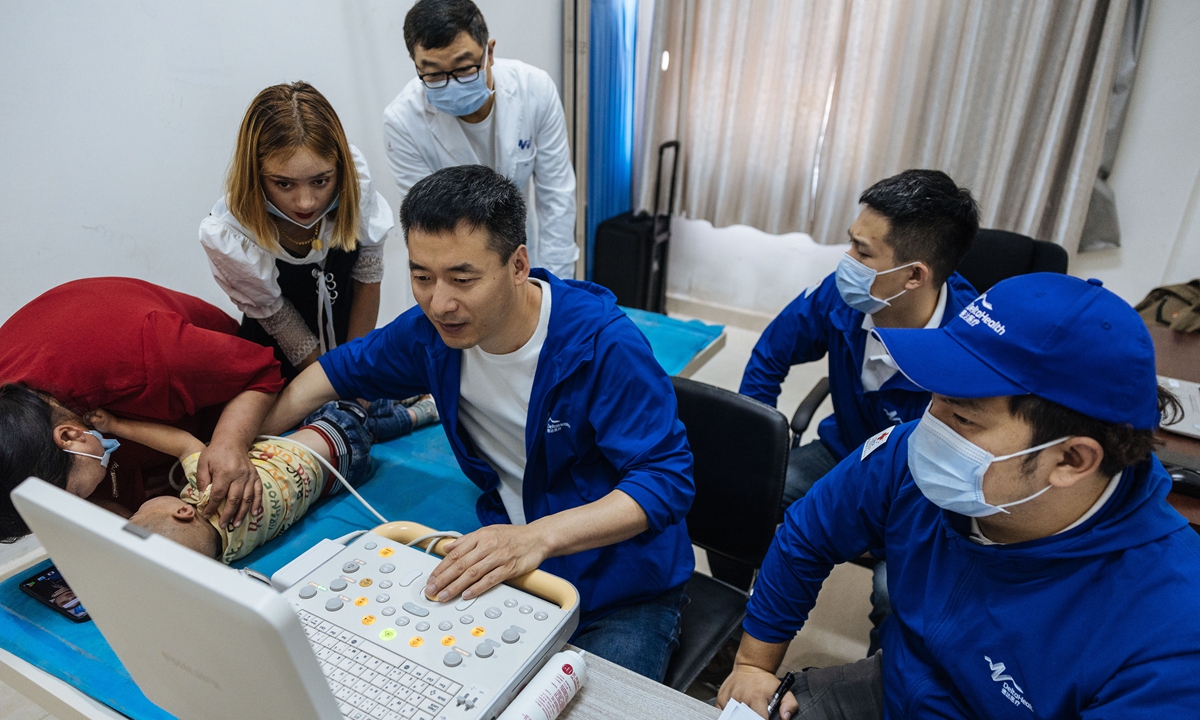 A medical team from the Shanghai DeltaHealth Hospital performs an ultrasound examination on a child in Shache county on May 15, 2023. Photo:Li Hao/GT