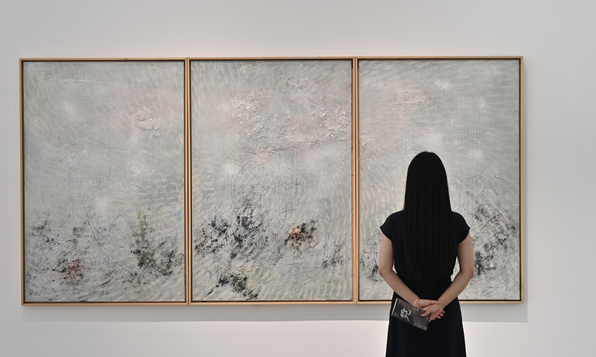 A visitor explores the exhibition. Photo: Courtesy of the Song Art Museum
