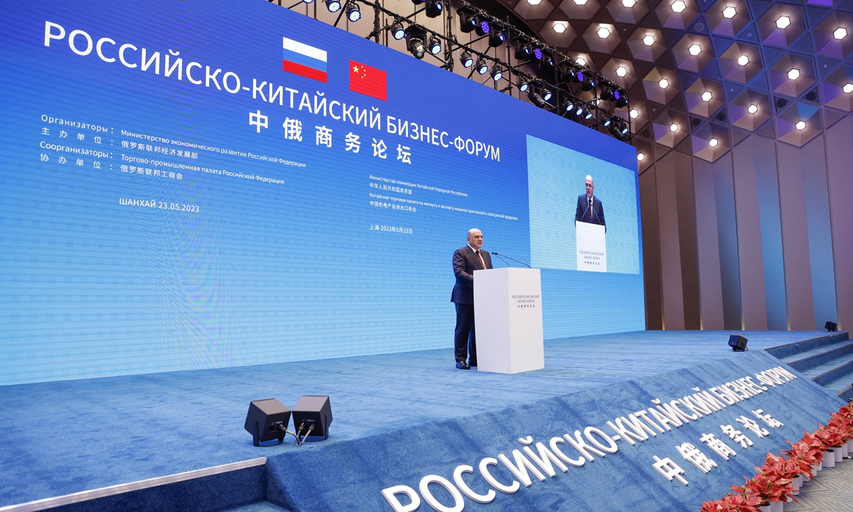 Russian Prime Minister Mikhail Mishustin addresses a Russian-Chinese business forum session in Shanghai on May 23, 2023. Photo: AFP