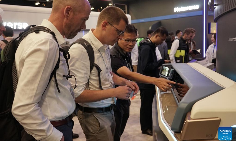 People visit the exhibition area of China's BOE Technology Group during the Display Week 2023 in Los Angeles, the United States, on May 23, 2023. Chinese brands gained a strong foothold at the Display Week 2023, a world's leading show of the display industry held this week in Los Angeles, attracting lots of attention and winning recognition for their innovative technologies and products.(Photo: Xinhua)