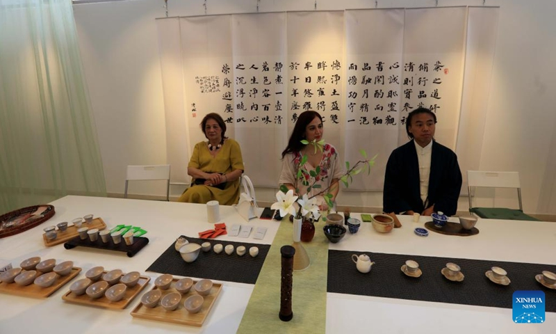 Visitors learn about tea culture during a cultural salon titled Tea for Harmony in Amman, Jordan, on May 24, 2023. The cultural salon was held here on Wednesday, offering the attendees an opportunity to immerse in the Chinese tea culture(Photo: Xinhua)