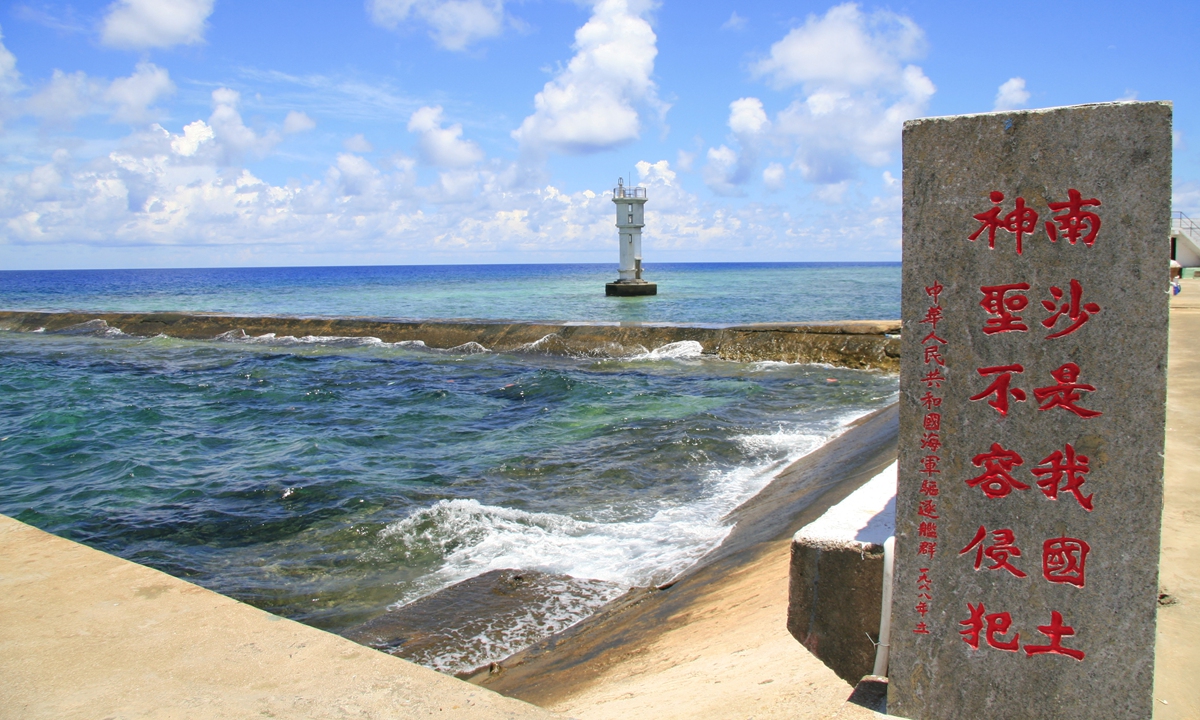 A lighthouse and a stele on Yongshu reef, Nansha Islands Photo: VCG